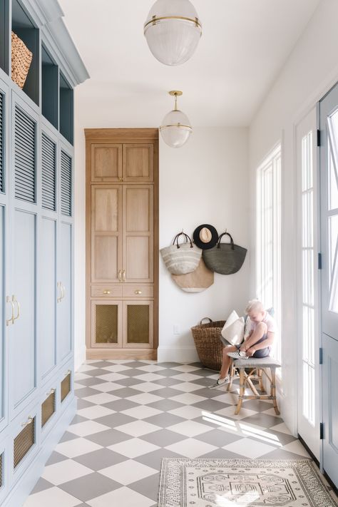 How beautiful is this mudroom? We love the gray and white checkered floor tile paired with the light blue mudroom cubbies! Metal grated front cabinets + mudroom storage ideas + dutch door into mudroom | Tiek Design Group Checkered Floor Tile, Mushroom Style, Checkered Floor, Mudroom Flooring, Mudroom Design, My Love Language, Blue Cabinets, Design A Space, Mud Room