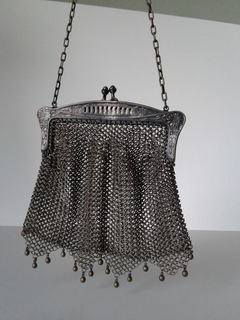 Vintage Chain purse with gorgeous detail. Top portion is marked G SILVER.  Top portion has beautiful flower and leaf design. All chain pieces are intact. Bottom has 4 triangular shaped drops with beaded accents. One bead is missing from the far side. Purse measures about 5"x5". Chain has 8" drop. Gorgeous  piece. I'll  let you shine it. Thanks for looking. Chainmail Bag, Chainmail Purse, Knight Core, Side Purse, Hippie Goth, Far Side, Silver Bags, Chain Purse, Vintage Chain