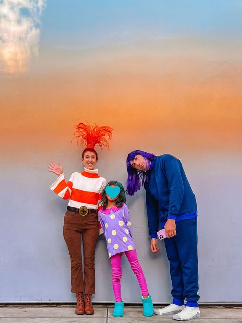 Family wearing Inside Out 2 costumes in front of ombre wall Inside Out Anxianity Costume, Ennui Costume, Envy Costume, Inside Out Costume, Diy Couples Costumes, Christmas Classroom Door, Costumes For Halloween, Ombre Wall, Simple Character