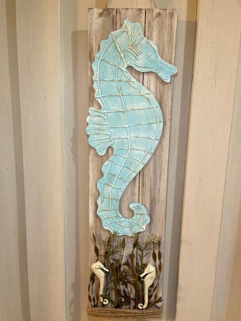 A detailed seahorse sign DIY using a dollar tree board sign, wood shore living seahorse, hot glue and shore living seahorse greenery. Seahorse Aesthetic, Beachy Signs, Dollar Tree Diys, Driftwood Fish, Burlap Canvas, Baby Dresser, Watch Diy, Turtle Decor, Tree Signs