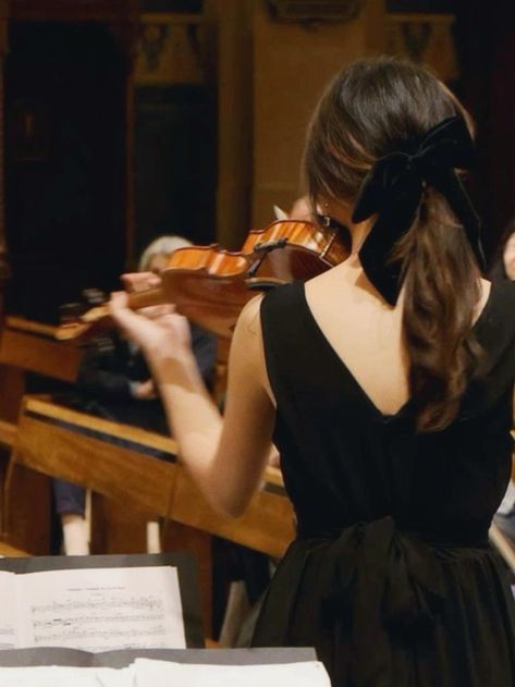 violinist girl Woman in black dress playing violin at a concert, music sheets visible in foreground. | Sky Rye Design Violin Performance Aesthetic, Playing Instruments Aesthetic, Violin Vision Board, Violin Girl Aesthetic, Playing Violin Aesthetic, Classical Musician Aesthetic, Violinist Aesthetic, Musicians Aesthetic, Violin Soloist