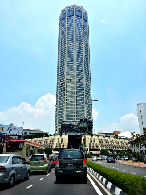 Komtar Tower, or Menara Komtar Complex is Penang's tallest building and the sixth tallest building in Malaysia located in the heart of George Town, dominating the island's skyline. KOMTAR is an acronym for Kompleks Tun Abdul Razak. When the skyscraper topped out it was the second tallest building in Asia after Sunshine 60 in Tokyo. Komtar was still Malaysia's tallest building for 3 years before it was surpassed by Menara Maybank in Kuala Lumpur in 1988. Komtar Penang, Tun Abdul Razak, Tokyo Skyline, Penang Island, George Town, Travel Packages, Kuala Lumpur, Southeast Asia, In The Heart