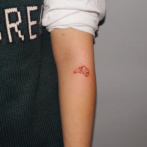 Small, red croissant tattoo on the left forearm Red Croissant, Croissant Tattoo, Cute Tattoo Designs, Cute Tattoo, Palm Tattoos, Tattoo Trend, Inspiring Pictures, Tattoo Hand, Red Ink Tattoos