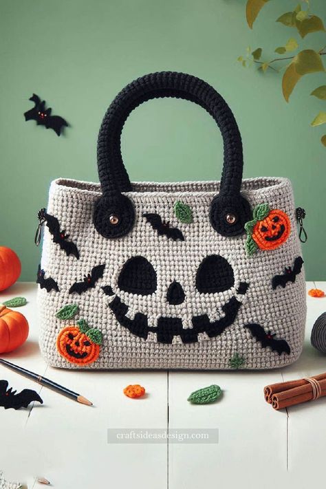 Halloween Crochet Bag is the perfect accessory to showcase your festive spirit while staying stylish. This charming bag features a delightful mix of Halloween-themed appliqués, including pumpkins, bats, and a spooky smiling face. Crochet Bag With Compartments, Crochet Halloween Bags Free Pattern, Crochet Halloween Bag, Pumpkin Crochet Bag, Crochet Halloween Cardigan, Crochet Halloween Purse, Pumpkin Purse Crochet, Crochet Halloween Purse Pattern, Crochet Handbag Patterns Free