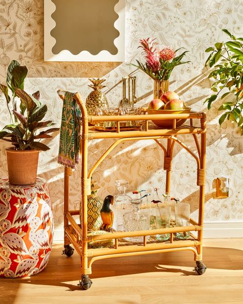 Post Image Whimsical Living Room, Tropical Bar, Rattan Bar Cart, Blooming Orchid, Rattan Bar, Pineapple Cocktail, Decorative Tea Towels, Bar Cart Styling, Spring Refresh