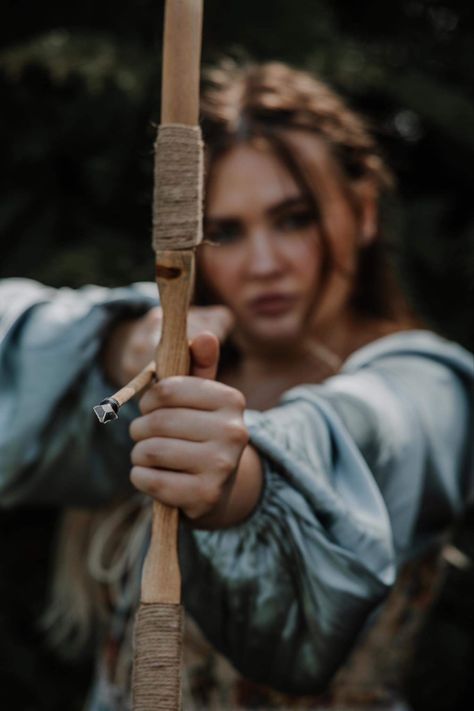 Bow and Arrow, senior photos, Katniss Everdeen aesthetic, corset, woman are strong Archery Women Aesthetic, Bow And Arrow Photoshoot, Bow And Arrow Woman, Aesthetic Bow And Arrow, Archery Aesthetic Female, Holding Bow And Arrow Reference, Bow And Arrow Reference, Strong Woman Aesthetic Photography, Bow And Arrow Aesthetic