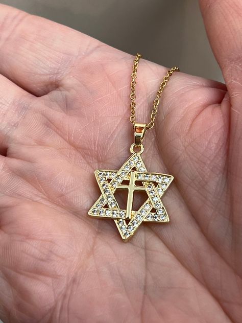 Jewish Star of David necklace and pendant in gold filled! * Pendant: 14k Gold plated * Size of Pendant: 14mm diameter * Gemstone: Cubic Zirconia * Chain: 14k gold filled * Chain type: Cable chain * Length of chain: 16", 18", 20" or  22" * Handmade jewelry! * Nickel free, hypoallergenic! * So pretty!! Perfect Christmas gift! This amazing 14k gold plated Star of David pendant and necklace comes with beautiful 14K gold filled cable chain and a lobster clasp! With perfectly cut Cubic Zirconia stones placed in the pendant, these are sure to sparkle! It is handmade in my studio in Coquitlam, Canada. The jewelry will not tarnish or turn your skin green. This is sure to be a great birthday or anniversary gift that will turn heads and will be adored by the wearer for years to come! Very beautiful a Star Of David Necklace, Jewish Star, Star Of David Pendant, Gift Envelope, Star Of David, Gold Star, Minimalist Necklace, Gold Filled Chain, Gold Stars