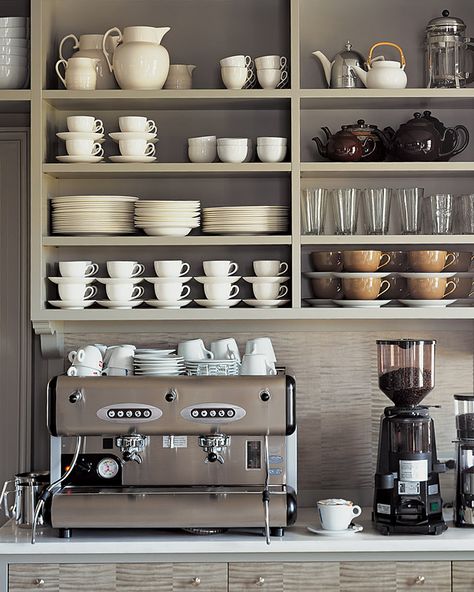 Everything Martha needs for a perfect cup of coffee or tea is all in one place: The espresso machine is on the counter; assorted cups, French presses, and teapots are on the shelves above; and everyday flatware and teas are in the drawers below. #marthastewart #kitchentips Kaffe Station, Martha Stewart Kitchen, Coin Café, Café Design, Diy Coffee Bar, Bar In Casa, Coffee Bar Design, Home Coffee Stations, Kabinet Dapur