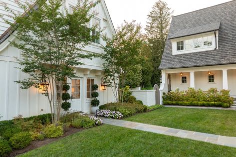 Main Line Landscape Design & Build | Terren Landscapes White Farmhouse Landscaping, Backyard Hill, Backyard Hill Landscaping, Line Landscape, Hill Landscaping, Landscaping On A Hill, Driveway Landscaping, Colonial Exterior, Farmhouse Landscaping