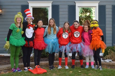 Super cute doctor suess group costume!! Things 1 and 2, cat in the hat, Lorax, red fish and blue fish, Cindy Lou Hu, and grinch!!! Cat In The Hat Group Costume, Dr Seuss Group Costume Ideas, Dr Suess Halloween Costume, Dr Suess Halloween Costumes, Dr Seuss Group Costumes, Thing Costumes Dr Seuss, Dr Suess Halloween Costume Family, Dr Seuss Family Costume, Doctor Suess Dress Up Ideas