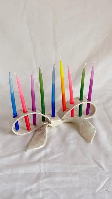 Rex design on Instagram: "I’m making Bow and Cake Menorahs ! Pre-order on my website now so your arrives in time for Hanukkah 😊 #menorah #ceramics #rexdesign #ceramicart #judaica" Clay Menorah Diy, Menorah Aesthetic, Clay Menorah, Neon Candles, Hanukkah Candle Holder, Menorah Candles, Hanukkah Candles, Winter Things, Hanukkah Menorah