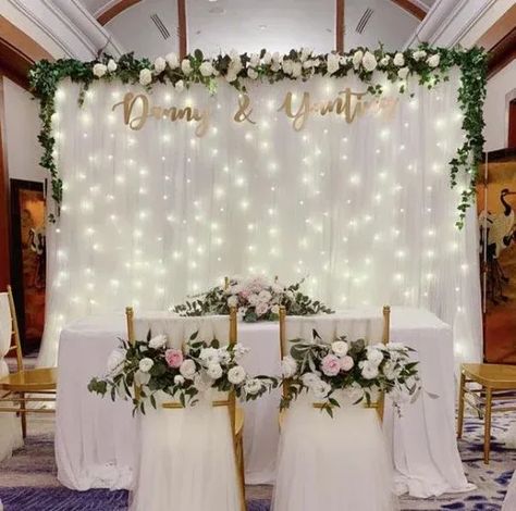 50+ Stunning Wedding Backdrop Design Ideas that are truly Enchanting | HubPages Wedding Backdrop With Fairy Lights, Wedding Backdrop Fairy Lights, Civil Wedding Backdrop Simple, Tulle Backdrop With Lights, Fairy Lights Wedding Decor, Wedding Backdrop With Lights, Simple Backdrop Decorations, Fairy Lights Backdrop, Lighted Backdrop