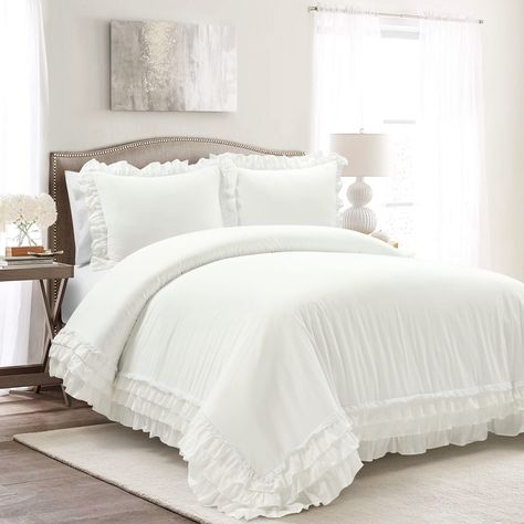 PRICES MAY VARY. 100% Cotton The delicate lace and ruffled trim on this duvet cover set brings your cottagecore dreams to life. Designed to be layered with your favorite throws and accessories, this elegant and cozy duvet cover has a simple look with a lot of style. With this delicately trimmed duvet cover set, you can finally give into your cottagecore dreams. Made with 100% cotton, layers of airy ruffles and lace trace the edge of the duvet cover and two matching shams. The duvet cover is equi Ruffle Comforter, Minimalist Cottage, Ruffle Duvet Cover, 100 Cotton Duvet Covers, White Comforter, Lush Decor, White Duvet Covers, Ruffle Bedding, White Duvet