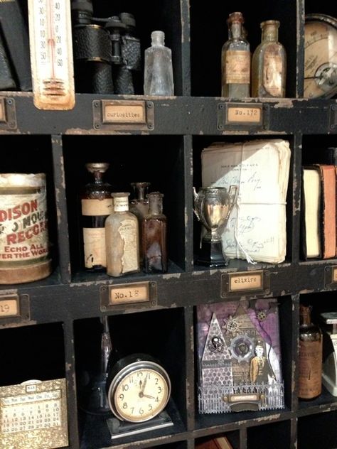 curio display of curiosities Curio Cabinet Displays Antique, Curio Wall Display, Antique Bottle Display Ideas, Wall Of Curiosities, Curiosity Cabinet Aesthetic, Curiosity Cupboard, Bottle Spells, Curio Cabinet Displays, Curio Display