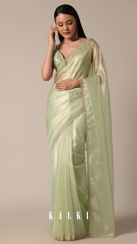 "Step into sophistication with this Graceful Green Tissue Saree. It is featuring meticulous bead and cutdana work on a scalloped border. The light green and glass tissue accents enhance the overall appeal, creating a perfect choice for your party wear collection. Meticulous detailing and the inclusion of unstitched blouse fabric ensure a customized fit.
" Pista Colour Saree, Pista Green Saree, Green Tissue Saree, Pista Green Pre-draped Saree With Sheer Dupatta For Party, Tissue Sarees, Pastel Colour Saree, Light Green Saree Look, Light Green Saree, Pastel Green Saree