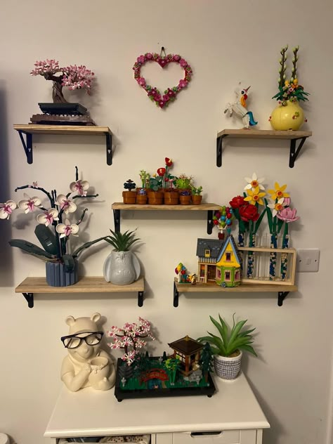 Legos In Living Room, Botanical Collection Lego, Lego Desk Decor, Cute Lego Display, Lego Wall Ideas, Lego Botanical Collection Display, Maximalist Shelf Decor, Lego Flower Display, Lego Display Ideas Shelves