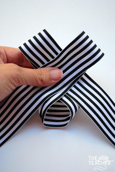 Tutorial: How to Tie the Perfect Bow - The Party Teacher How To Make A Flat Bow With Ribbon, Bow Tie Ribbon Diy, How To Tie A Flat Bow With Ribbon, Tying A Large Ribbon Bow, Bow Knot Tutorial, How To Make A Bow Clothes, Easy Bow Tutorial Ribbons, Now Tying With Ribbon, Tie A Bow With Wired Ribbon