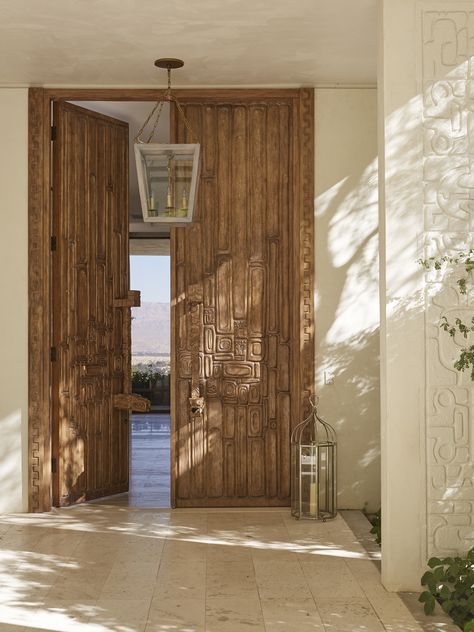 Carved wood front doors entry, Michael S. Smith Interiors / Portfolio Entrance Door Design Luxury, Corporate Office Exterior, Entrances Architecture, Door Design Luxury, Mid Century Mediterranean, Cocktail Tower, Middle Eastern Home, Front Door Display, Indoor Outdoor House