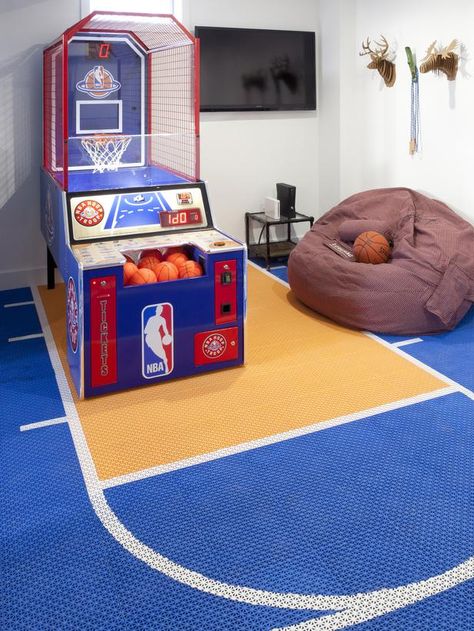 Decorating Ideas for Fun Playrooms and Kids' Bedrooms : If you’re going to get an arcade game, why not get a floor to match? Not only are these rubber floor mats colorful and well thought out, they are ideal for a playroom because they are soft and warm on the feet, and they will acoustically buffer the sound of kids bouncing basketballs in the house. From DIYnetwork.com Basketball Bedroom Decor, Basketball Bedroom, Fun Gadgets, Basketball Room, Game Room Kids, Ideas For Fun, Arcade Room, Indoor Basketball, Playroom Design