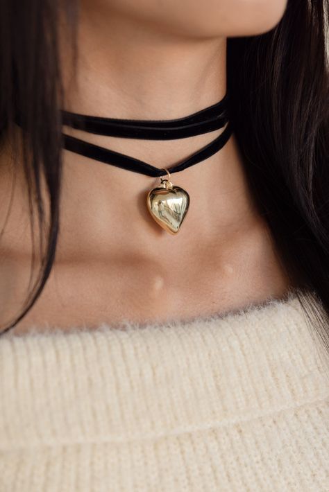 Our Velvet Bow Choker in black is a tie front choker necklace with gold heart details. #Timeless #A #Necklaces #Choker #of #of #Allure #Accessories #World #the #Exploring #Exploring #Statement #Fashion #The Black Bow Choker, Chockers Ideas, Black Choker Aesthetic, Black Choker Outfit, Chokers Aesthetic, Black Necklace Choker, Classy Aesthetics, Choker Ideas, Choker Velvet