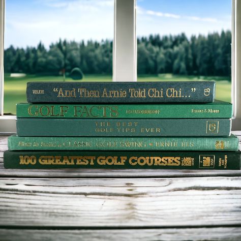 Green vintage GOLF books stack. Set of 5. Would be perfect for the golfing or sports themed room! Great for reading, collecting, bookshelf styling, home staging or table accent decor.  THIS IS THE EXACT SET YOU WILL RECEIVE!  They date between 1982-2003. This set measures 11 and 1/8 inches across, 8 and 1/4 inches wide and 4 and 1/4 inches tall, as shown lying down in the first photo.  See all photos for further description!   Please contact me if you have anymore questions about this vintage green golf book set. **MY BOOKS ARE SHIPPED USPS MEDIA MAIL TO SAVE YOU LOTS OF $$ SHIPPING HEAVY BOOKS. THIS DOES HAVE A STATED DELIVERY TIME OF 3-10 DAYS. IF YOU PREFER TO PAY EXTRA FOR PRIORITY SHIPPING, PLEASE MESSAGE ME FOR A QUOTE** Vintage Golf Room, Golf Themed Room, Golf Theme Office, Golf Decorating Ideas Interior Design, Vintage Golf Decor, Golf Room Decor, Golf Home Decor, Moody Basement, Golf Man Cave