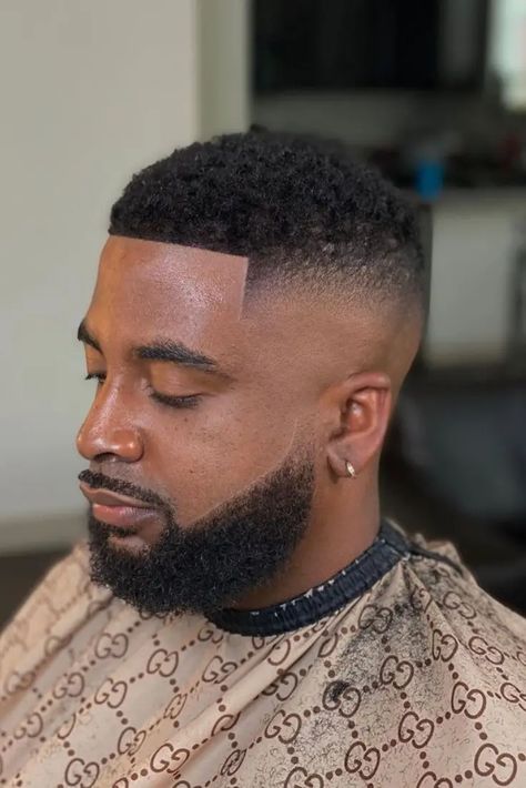 Achieve a sleek and modern look with short hairstyles for black men paired with well-groomed beards. From classic fades to textured styles, these combinations exude confidence and style. Whether you prefer a low fade, high fade, or buzz cut, these styles offer a clean and sophisticated appearance that suits any occasion. Embrace your natural texture with short curly hairstyles for black men complemented by a stylish beard. These looks celebrate your unique hair type and enhance Hair Cuts For Black Men Low Fade, Hảir Style For Men Short Hair, Short Black Hairstyles Men, Nice Haircut For Men, Short Hair Fade Men, Hairstyles For Short Hair For School, Fade And Beard, Black Fade Haircut, Afro Hair Fade