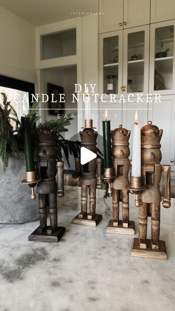 LIZ +  AMY on Instagram: "Diy the cutest nutcracker candles 🤍 when I saw these online and didn’t get them in time I knew I had to make them! Aren’t they so fun?! These would also make a great gift for a host or anyone really. I also made one that sits on the top of its head.  All I did was cut off the knob and glue it.  The most important part is gluing on the candlestick holder. Be sure it’s far enough forward, that way it sits away from the nutcrackers head, so when you light it the flame is not near the wood. Also, be sure it’s level with the little candlestick holder below. So easy guys! I’ll share all the details, step by step and supplies I used in stories. I’ll also save it to my highlights 🤍 #diychristmas #nutcracker" Nutcracker Inspired Christmas Decor, Nutcracker Themed Christmas Decor Diy, Unique Nutcracker Ideas, Christmas Nutcracker Theme, Nutcracker Candle Holder, Diy Painted Nutcracker Ideas, Painting Nutcrackers, Nutcracker Themed Christmas Decor, Painted Nutcracker Diy