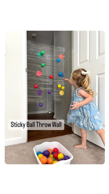 Rozanne | Bright Little Brains on Instagram: "STICKY BALL THROW WALL Here’s a great activity to make use of those colored SOFT PLAY BALLS!! YOU’ll NEED: 🔴 Tape (Clear box tape) (Contact paper will also work) 🟡 Circled colored paper 🟢 Colored balls ‼️If you are afraid of paint that might go off from the door frame, cover the area with painters tape first and then apply the sticky tape‼️ Have a great weekend everyone!! #earlylearning #momhack #learningthroughplaying #learningthroughpla Wall Ball Maze Diy, Ball Sensory Activities, Soft Motor Skills Activities, Activities With Ball Pit Balls, Ball Games For Kindergarten, Toddler Tape Activity, Tape Ball Game, Throwing Activities For Preschool, Throwing Activities For Toddlers