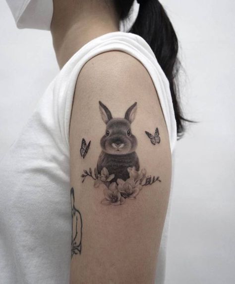 Micro-realistic rabbit tattoo on the upper arm. Rabbit Portrait Tattoo, Tattoo Designs On Arm, Rabbit Tattoo Design, Cute Animal Tattoos, Unique Rabbit, Baby Tattoo Designs, Rabbit Tattoo, Tattoos Meaning, Bunny Watercolor