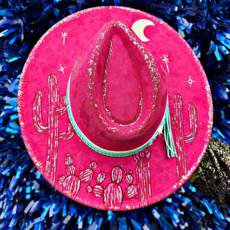 Shop this cosmic hand burned and painted hat on our website today. . . www.thevelvetfoxcompany.com . . . #hat #hats #painted #paintedhat #handburned #burnedhat #desert #cosmic #trippy #lisafrank #pink Hand Burn, Lisa Frank, Cowboy Hat, Cowboy Hats, Cowboy, Hats, Pink, Quick Saves, Art