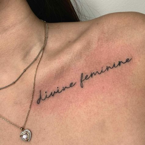 Cursive Collar Bone Tattoo, Collar Bone Word Tattoos For Women, Collar Bone Tattoo Writing, Collar Bone Writing Tattoo, Chest Tattoo Female Upper Shoulder, Collarbone Tattoo Quotes, Define Feminine Tattoo, Divine Feminine Tattoo Collarbone, Collarbone Tattoo Words