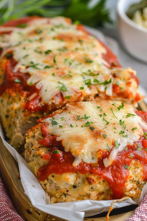 Dive into a mouthwatering twist on classic meatloaf with our Parmesan Chicken Meatloaf recipe! Packed with flavor, it's a family favorite. Try it tonight! Chicken Parmesan Meatloaf Muffins, Chicken Parm Mini Meatloaf, Keto Beef Recipes For Dinner, Garlic Parm Meatloaf, No Red Meat Dinner Ideas, Garlic Parmesan Chicken Mini Meatloaf, Garlic Parm Chicken Meatloaves, Parmesan Chicken Meatloaf, Garlic Parm Chicken Meatloaf