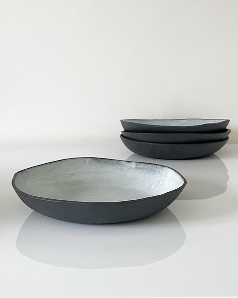 DIMENSIONS: Approximately 9" Diameter x 1.5" High. Each exceptionally beautiful organically shaped clay/stoneware pasta/coupe bowl is unglazed on the outside with a stunning grey satin glaze on the inside. Can also be used as a salad or dinner bowl. Mix, match and pair with the Luna Large Dinner Plates, Luna Plates + Luna Dessert Plates for a complete dinnerware set. All Atelier Forma items are HANDMADE. Therefore pieces will show marks of the making process. Each piece is unique, built with att Black Clay Plates, Handmade Pasta Bowl, Clay Salad Bowl, Black Clay Pottery, Ceramic Pasta Bowls, Handmade Ceramic Plates, Ceramic Dishware, Dinner Bowl, Bowls Ceramic