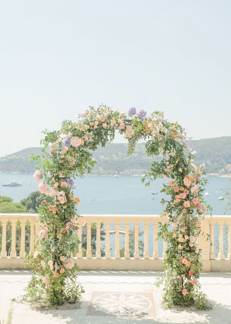 Seaside Wedding Ceremony, Wedding Ceremony Flower Ideas, Pastel Flower Arch Wedding, Garden Party Wedding Arch, Pastel Wedding Ceremony Flowers, Pastel Wedding Arch Flowers, Arch Ideas For Wedding, Pastel Arch Wedding, Pastel Wedding Aisle