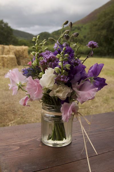 Jam jars with wedding flowers#Repin By:Pinterest++ for iPad# ขวดโหล Mason Jar, Jam Jar Flowers, Flowers In A Jar, Jar Flowers, Flower Types, Purple Table, White Centerpiece, Jam Jars, Flowers In Jars