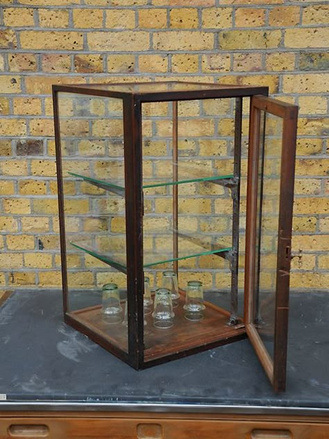 Antique display cabinet removed from a tool shop. Heavy duty but delicate oak frame with original glass and brass fittings - including an ingenious handle. Original condition.  created by: Barrett of Camberwell  origin: UK  year: 1920 Display Box Ideas, Crystal Collection Display, Antique Display Cabinet, Antique Display Case, Antique Display Cabinets, Iconic Outfits, Spot It, Iconic Furniture, Beautiful Storage