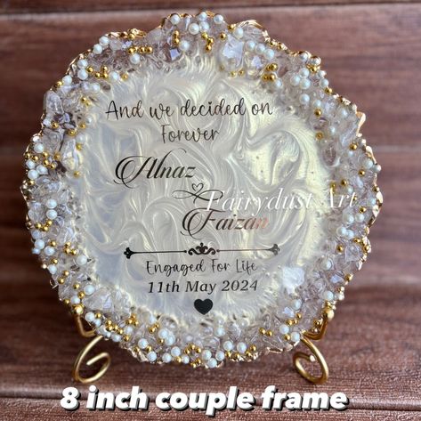 Couple frames are a trendy and aesthetic gift to decorate the room . Dm to order yours @fairydustart_16 . [ couple gift, couple gifts, anniversary gift, anniversary gifts, wedding gift, wedding gifts, anniversary gift] Resin Art Ideas For Couples, Resin Frames For Couples, Resin Art Wedding Gift, Anniversary Frame Ideas, Resin Frame Ideas, Engagement Gift Ideas For Couples, Raisin Art, Engagement Tray, Decorate The Room