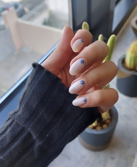 Nude nails woth evil eye design Evil Eye Manicure Nail Designs, Short Nails Evil Eye Design, Evil Eye Nails Design Short, Nail Art Eyes Design, Nails With Evil Eye Design, Evil Eye Gel Nails, Nails Evil Eye Design, Nail Inspo Evil Eye, Evil Eye Nails Short