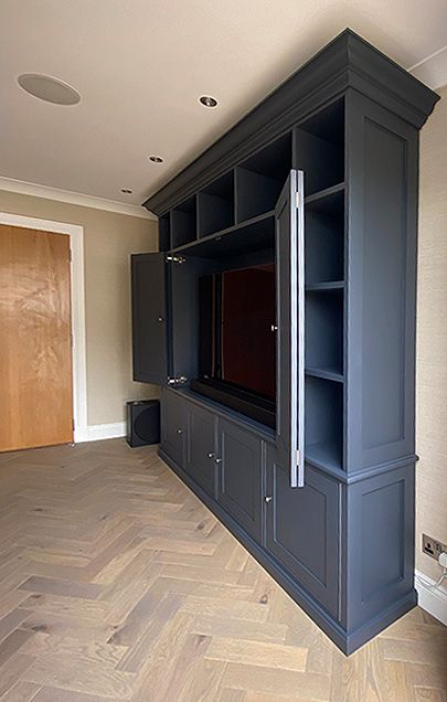 TV wall unit with doors to hide TV Media Cabinet With Doors, Built In Tv Wall Unit Hide Tv, Bifold Tv Cabinet Doors, Hidden Tv Media Wall, Built In Hidden Tv Wall Unit, Hidden Tv In Cabinet, Built In Tv Cabinet With Doors, Hideaway Tv Cabinet, Hidden Tv Bookshelf