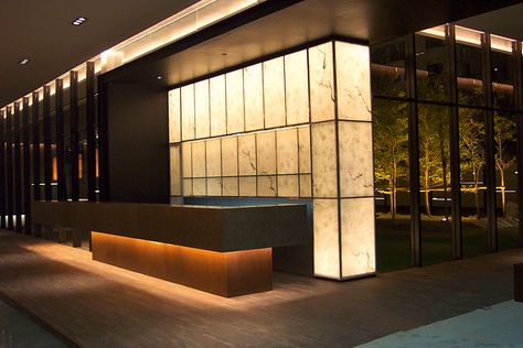 Reception desk, under light, back lit onyx, bronze frame, heavy stone top, Reception Desk Lighting, Hotel Reception Design, Reception Hotel, Hotel Reception Desk, Hotel Lobby Design, Reception Desk Design, Lobby Reception, Mix Use Building, Cove Lighting