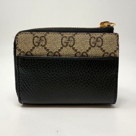 Gucci Wallet with GG Gold-Tone Logo and Hardware and L Shape Zip Closure Designer = Gucci Color = Black/Brown Material = Leather Blend Condition = Very Good Location: Chicago Item Number: 4307-240 Item ID: 320736 Category: Wallet Gucci Wallet, Black And Brown, Black Color, Wallet, Gucci, Black