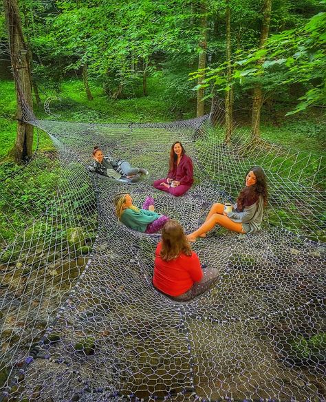 Come to New Moon Retreat in North Carolina to socialize, hangout, and even meditate right above the water! Tree Net Hammock, Tree Hammock Ideas, Natural Tree House, Net Tree House, Outside Fort Ideas Woods, Tree Net Hangout, Outside Fort Ideas, Inside Treehouse Ideas, Woods Hangout Spot