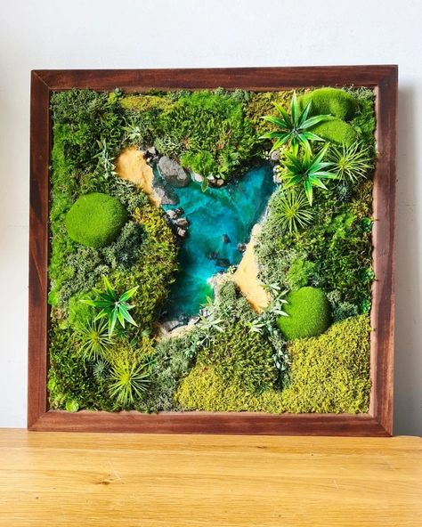 A little foray into resin art today. A lush preserved and faux moss encased sandy lagoon in a 45.5cm square frame with a walnut stain finish. #framedrealitydesigns #mossart #preservedmossdecor #preservedmossart #resinartwork #etsyseller #etsysellersofinstagram #bluelagoon #mosswallart Moss Board, Moss Artwork, Scandinavian Moss, Mos Wand, Moss Frame, Home Decor Business, Decor Business, Moss Decor, Faux Moss