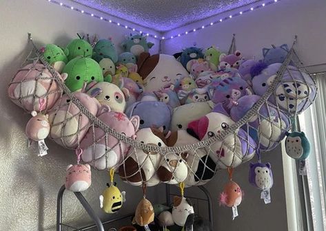 15 Best Squishmallow Storage Ideas (2022 Updated) Hanging Nets For Stuffed Animals, Squishmallows Hanging Net, Stuffed Animal Net Diy, Shelf Of Stuffed Animals, Squishmellow Hammock, Net To Hold Stuffed Animals, Crochet Stuffed Animal Storage, Large Squishmallow Storage, Net For Squishmallows