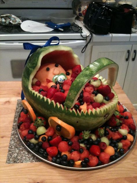 Get How To Make Watermelon Fruit Bowl For Baby Shower Baby Shower Fruit Tray, Fruit Basket Watermelon, Watermelon Baby Carriage, Watermelon Fruit Bowls, Watermelon Basket, Baby Shower Desserts Boy, Baby Shower Watermelon, Baby Shower Fruit, Fruit Creations