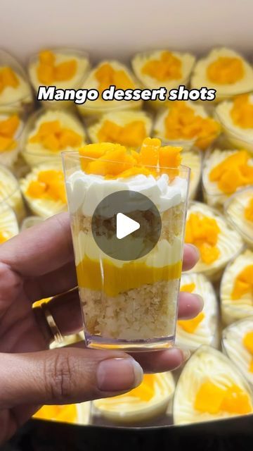 Preeti Kapil Bothra on Instagram: "Mango dessert shots to you: Mein aesi cheez hu... bilkul Lazeez hu 🤌 This heavenly dessert is the vibe of this summer! This Mango dessert shots is to die for! The smooth texture of cream cheese, taste of mango and crunch of biscuits...uff! Too good! . . #CAKALICIOUSCAKE #mangocake #mangodessertcake #mango #PartyDesertShots #SuratBaker #HomeBaker #SuratCake" Mango Shooters, Dessert Shots Recipes, Mango Graham, Cake Shooters, Mango Float, Mango Mousse Cake, Deserts Cupcakes, Dessert Shooters, Dessert Shots