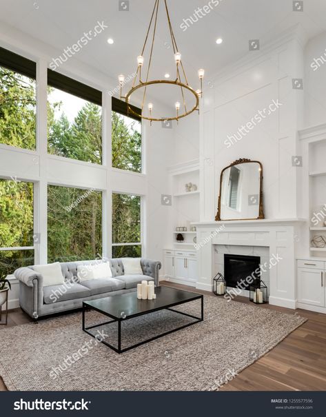 Living Room Luxury Home Tall Ceiling Stock Photo (Edit Now) 1255577596 Modern Linear Chandelier, Square Chandelier, Eclectic Area Rug, Farmhouse Chandelier, Urban Loft, Geometric Chandelier, Loft Living, Tall Ceilings, Outdoor Sconces