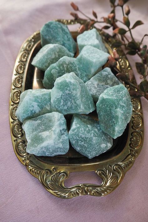 Aventurine, a variety of quartz, is known for its shimmering effect caused by tiny mineral inclusions. It is often green but can also be found in shades of blue, brown, orange, and red. Aventurine is associated with prosperity, abundance, and luck. It is also believed to promote emotional well-being, strengthen personal growth, and aid physical healing and vitality. FOR MORE INFORMATOIN PLEASE VISIT OUR WEBSITE . Website Link in Profile Aventurine Aesthetic, Steven Universe Reference, Cristal Stone, Abundance Crystals, Earth Witch, Red Aventurine, Green Aventurine Crystal, Crystal Aesthetic, Physical Healing