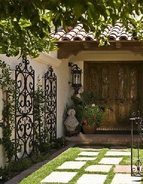 Discover how to transform your patio into a lush oasis with these 8 simple tips for a thriving garden. From selecting the perfect plants to creating a cozy seating area, these ideas will help you bring beauty and serenity to your outdoor space. Let your garden bloom with love and create a peaceful retreat right at home. #patiogarden #gardeningtips #greenthumb #outdooroasis #gardenlove Wrought Iron Trellis, Patio Wall Decor, Iron Trellis, Bed Headboards, Wrought Iron Decor, Patio Wall, Spanish Style Homes, Front Entrance, Iron Gate