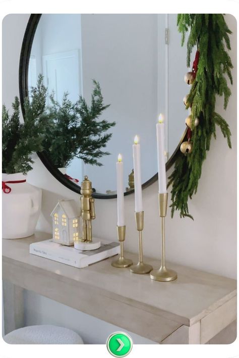 Elegant console table Christmas decor with candles and fresh greenery. Perfect for adding a refined holiday touch to entryways or hallways, welcoming guests in style. Christmas Entryway Table Decor Elegant, Console Table Christmas Decor, Decor With Candles, Christmas Decir, Decorating Hallways, Hallway Table Decor, Christmas Hallway, Table Christmas Decor, Classy Christmas Decor